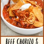 chili in a bowl with corn chips and spoon