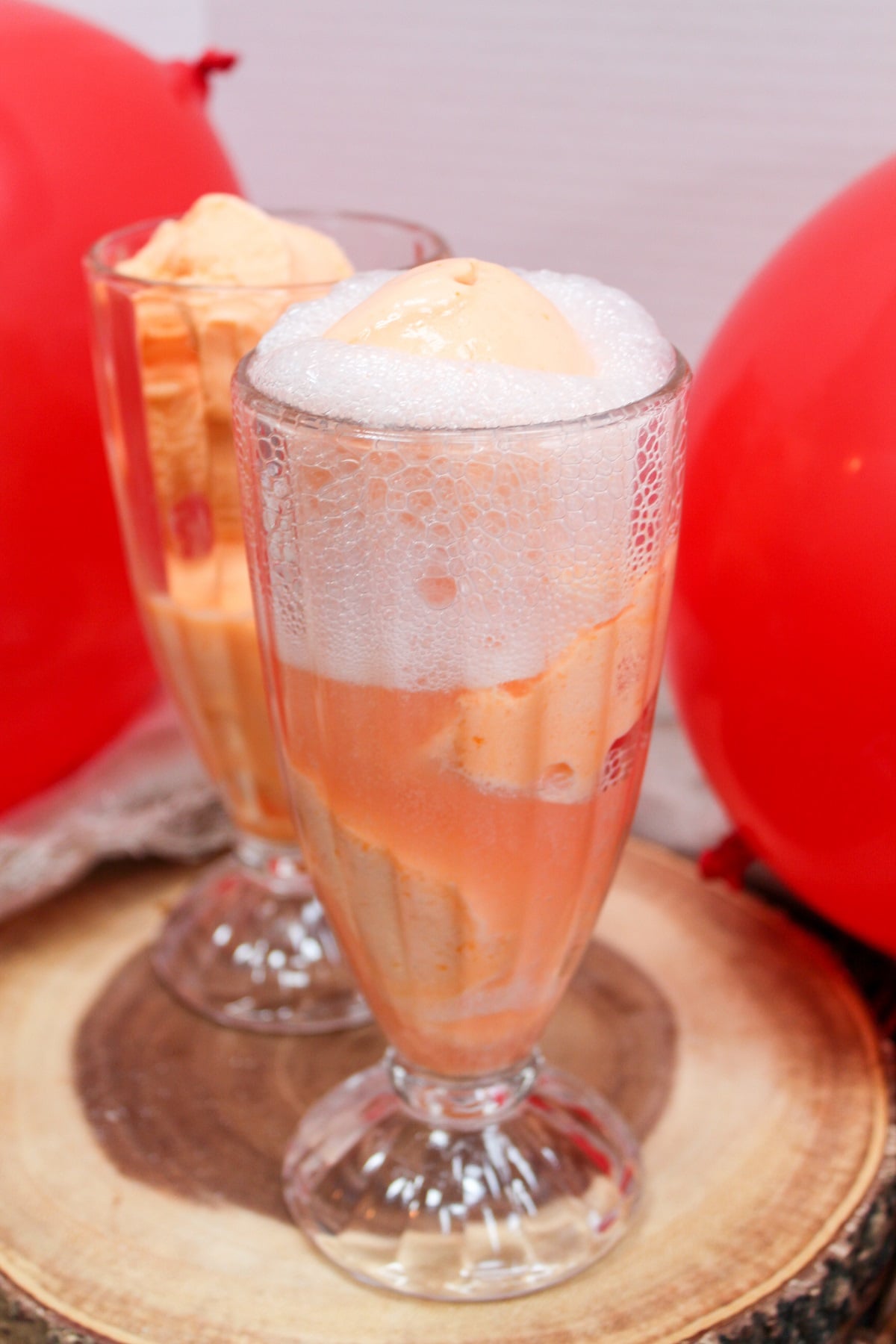 ice cream float in a glass with cherry soda