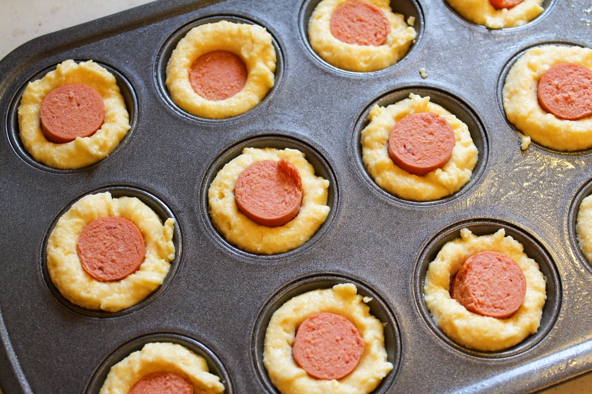 corn dog muffin uncooked in pan