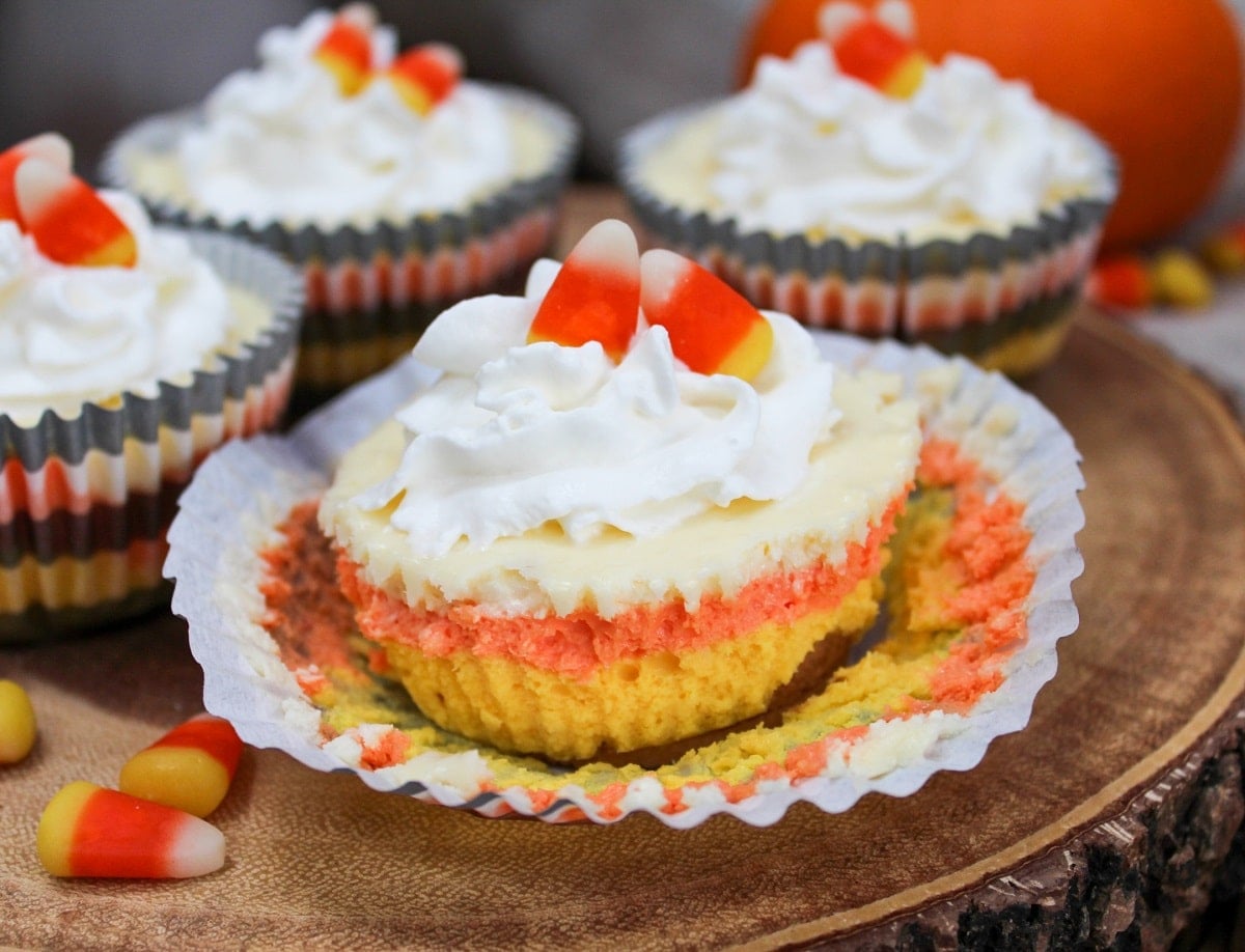 cheesecake with wrapper off and showing yellow orange and white colors