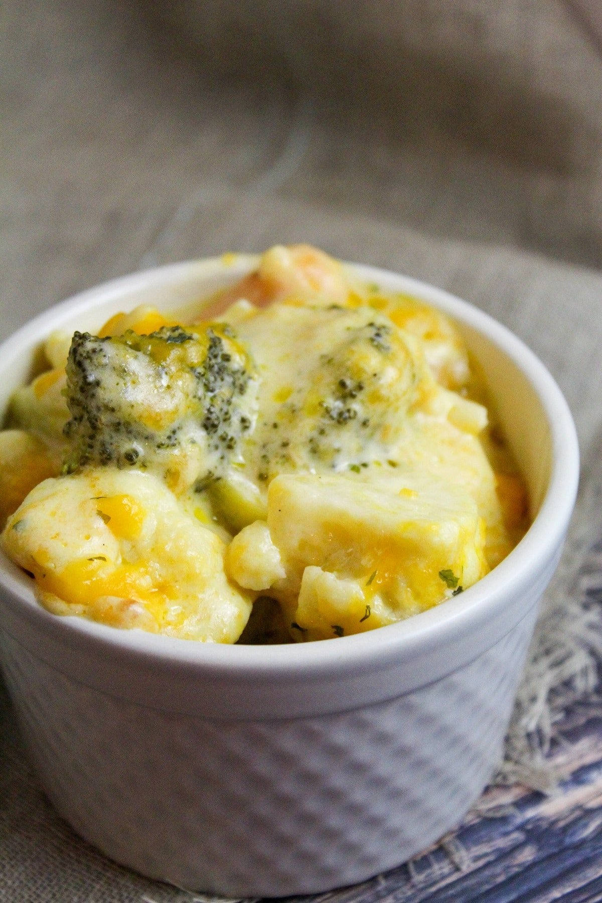 cheesy vegetables in a small bowl