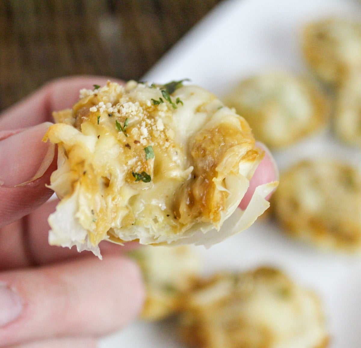 french onion tartlete with bite taken