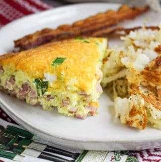 denver omelette on a plate with hashbrowns