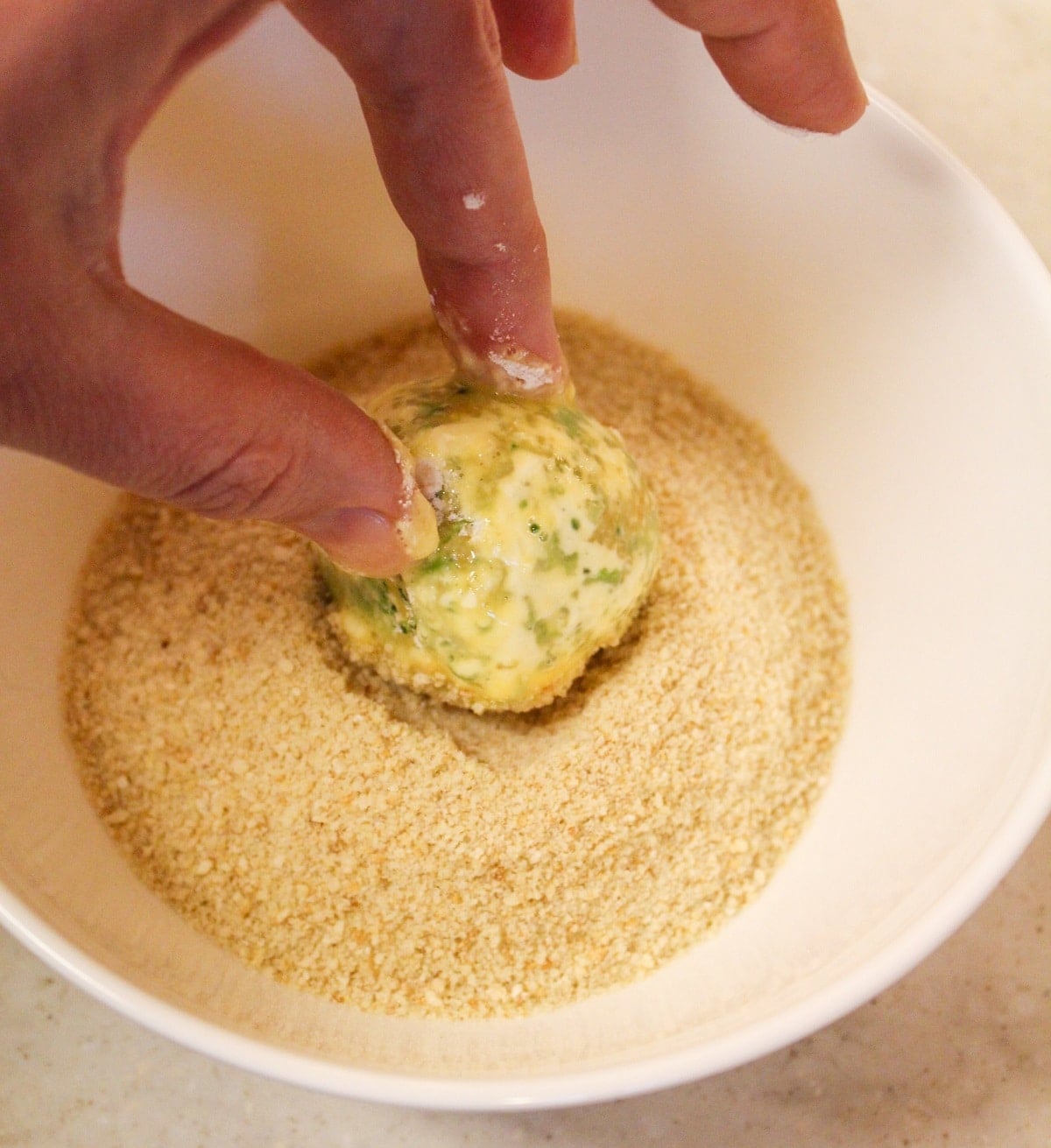 bite dipped in bread crumbs