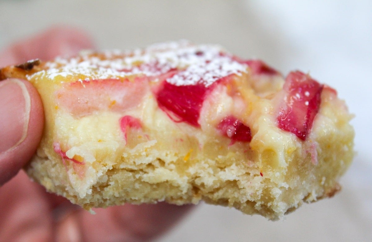 citrus rhubarb custard bars with bite taken