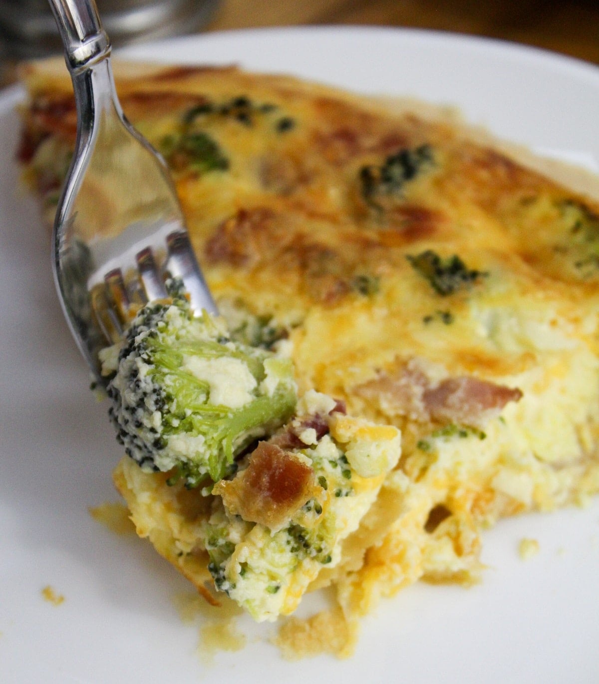 bacon broccoli quiche on a fork