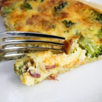 bacon broccoli quiche cut with a fork