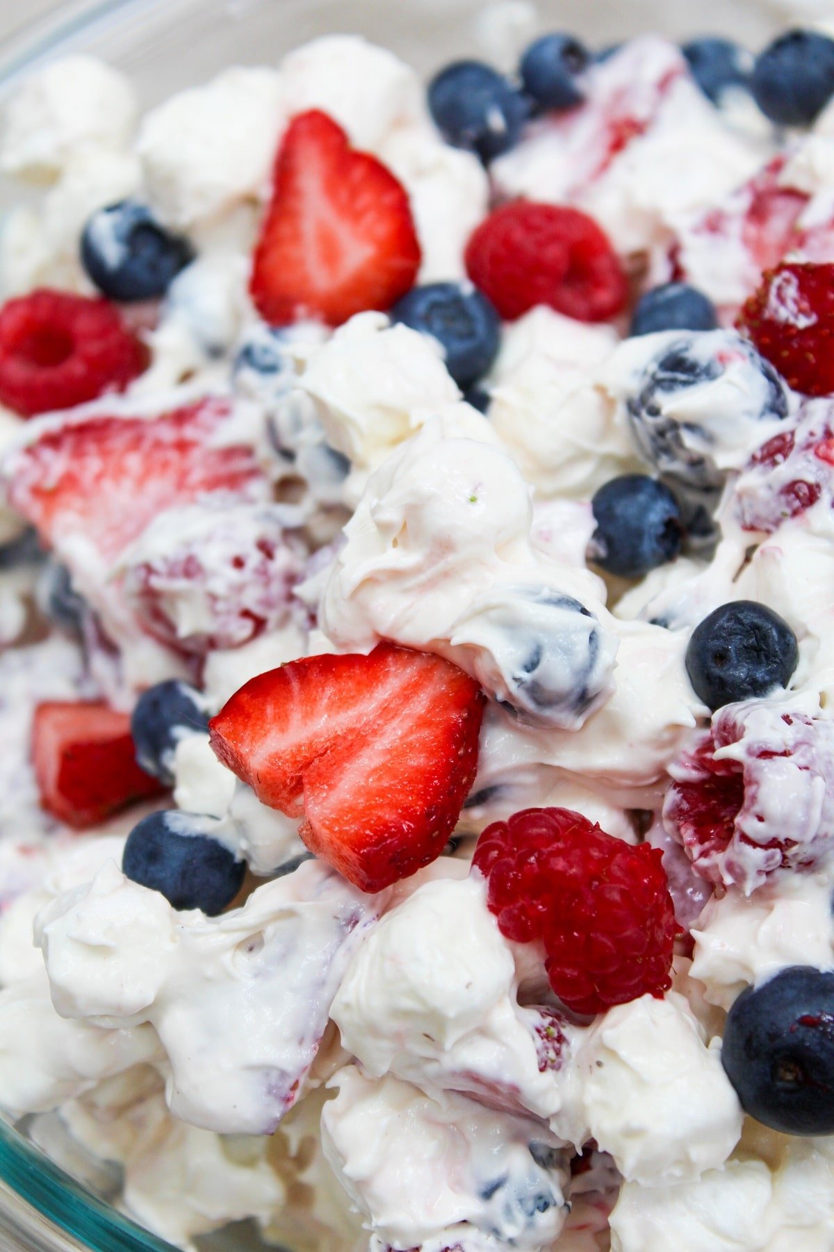 close-up photo showing berries on top of the salad