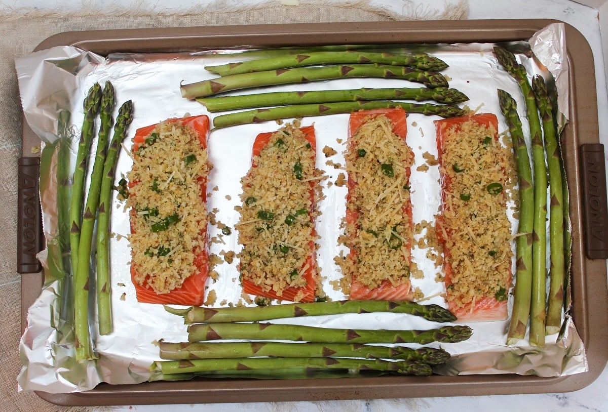 salmon with topping and asparagus