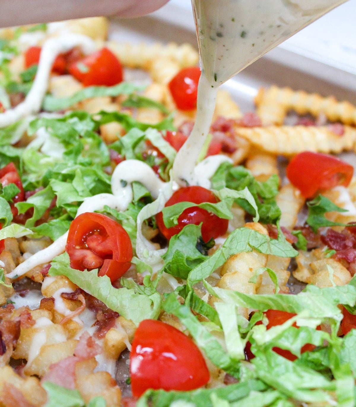 loaded blt fries with sauce poured on top