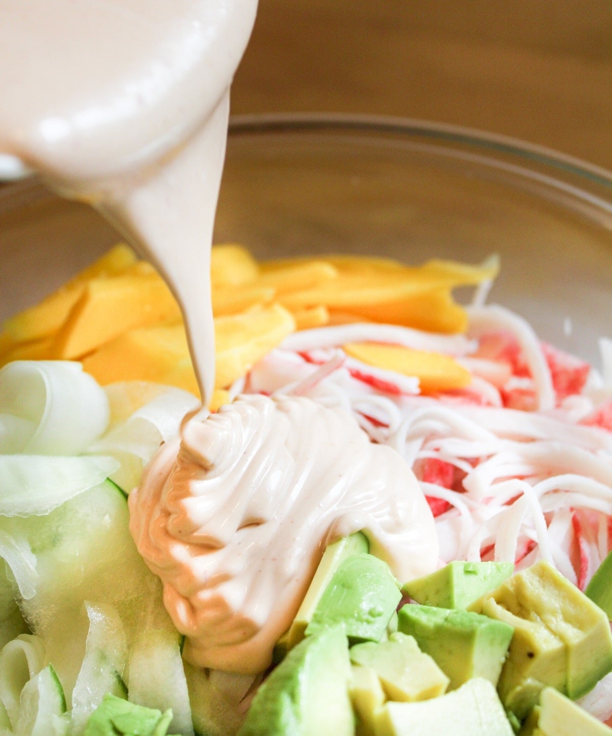 dressig poured over the kani salad