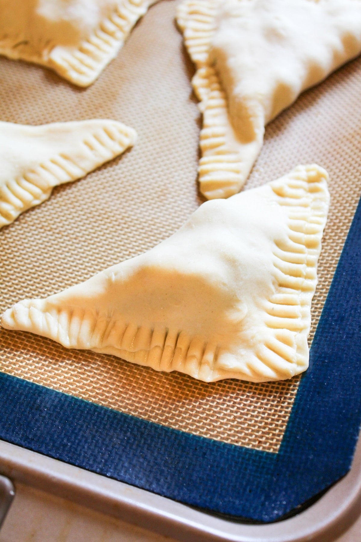 uncooked turnover on baking sheet