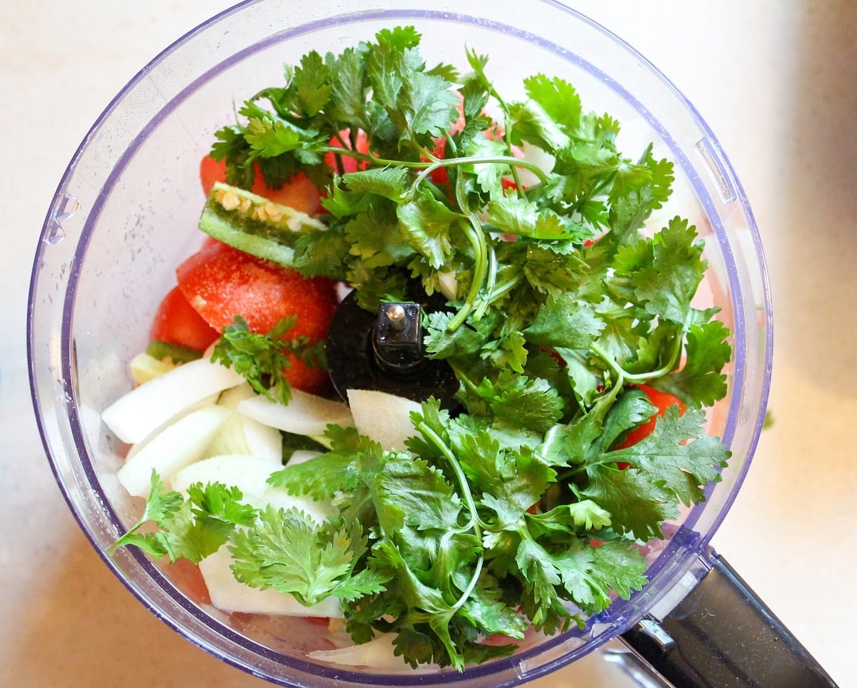 tomatoes, pepper, onions, cilantro in a food processor