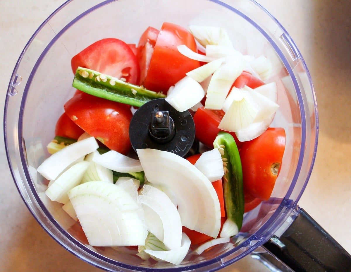 tomatoes, pepper, onions in a food processor