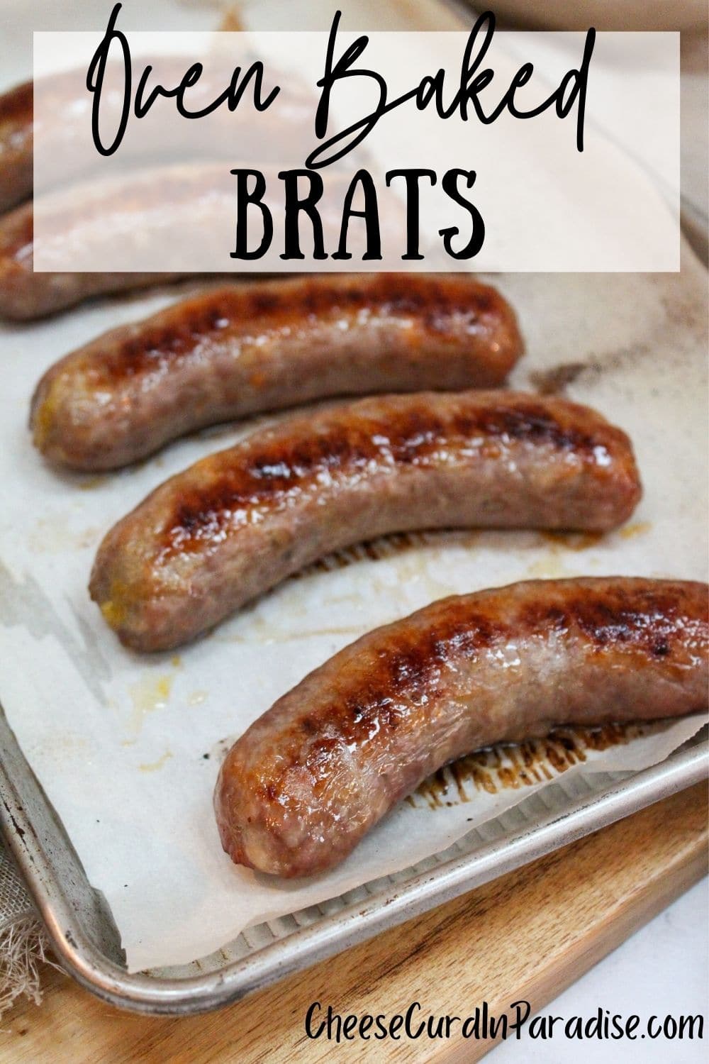 oven baked brats on a baking sheet