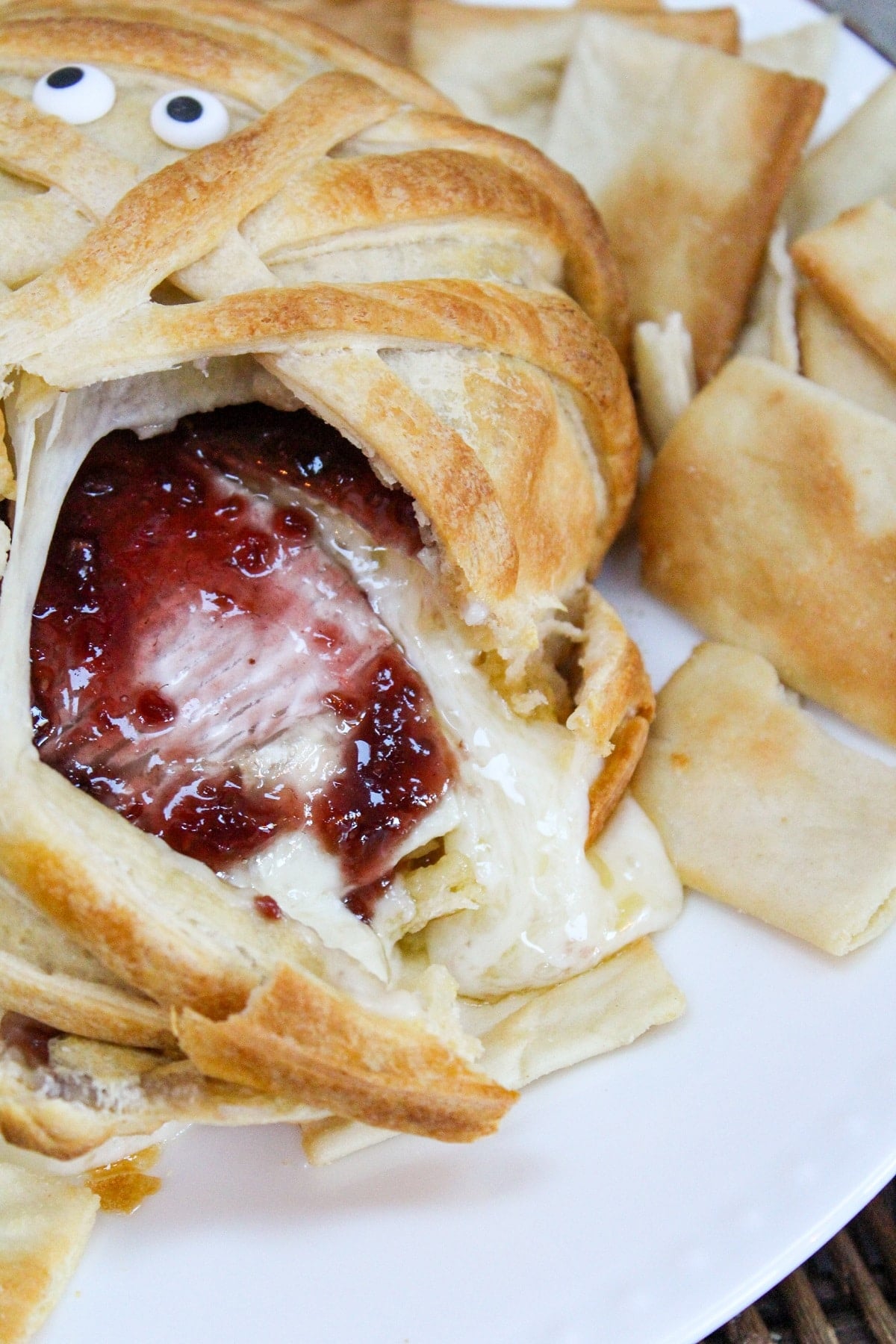 cut brie with raspberry jam