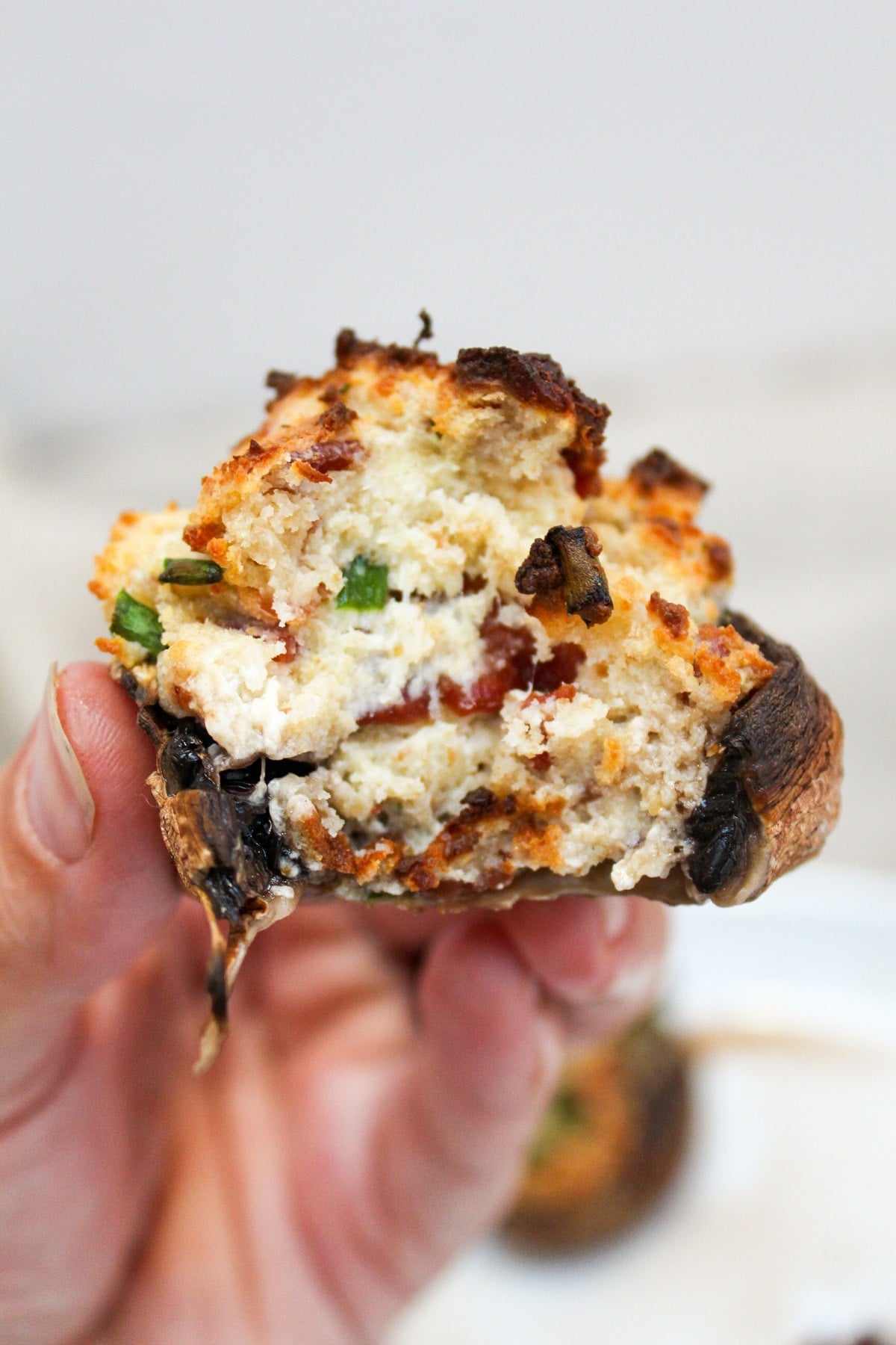 air fryer stuffed mushroom with a bite taken