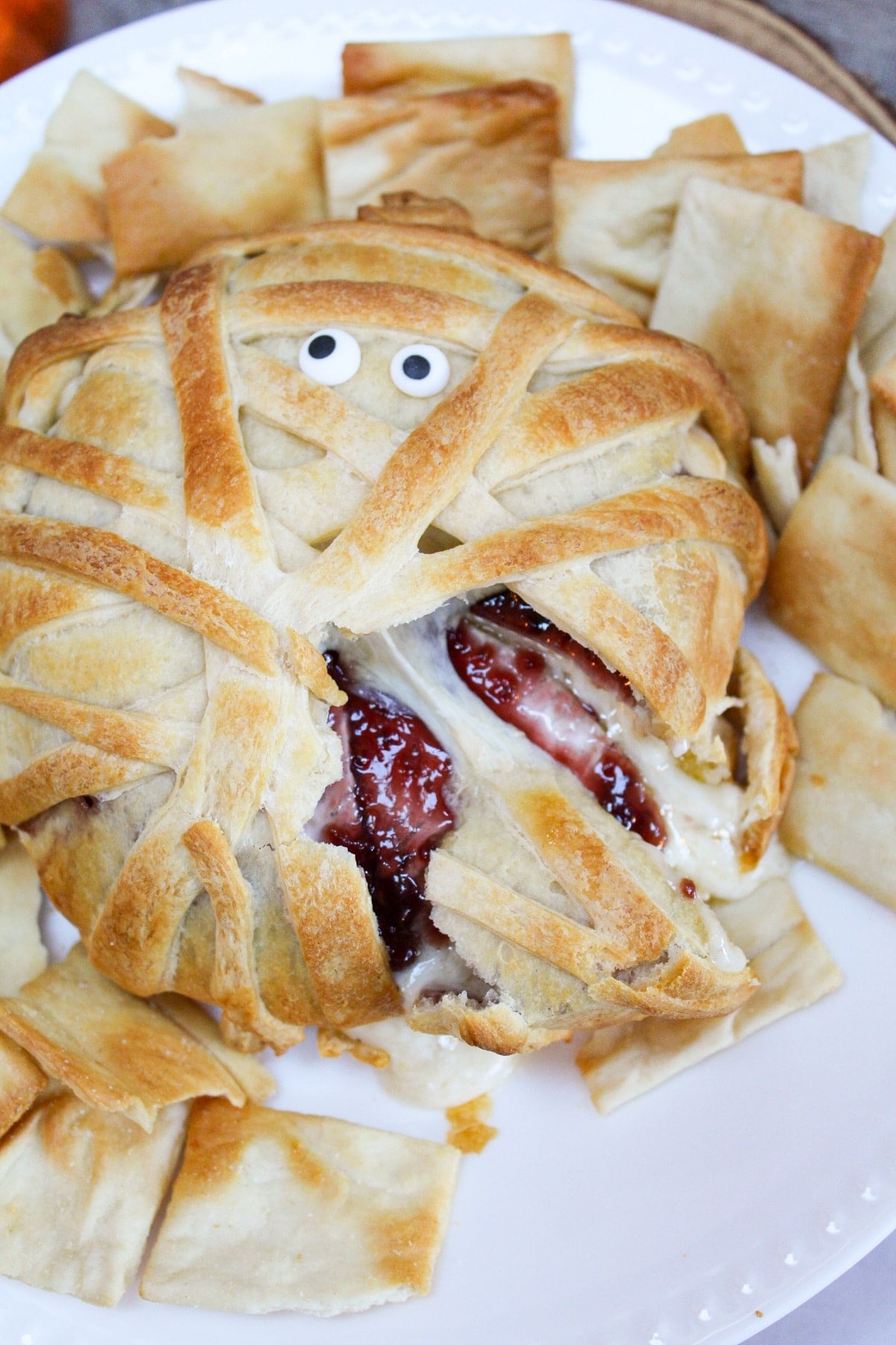 cut brie with raspberry jam