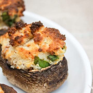 air fryer stuffed mushroom on a white plate