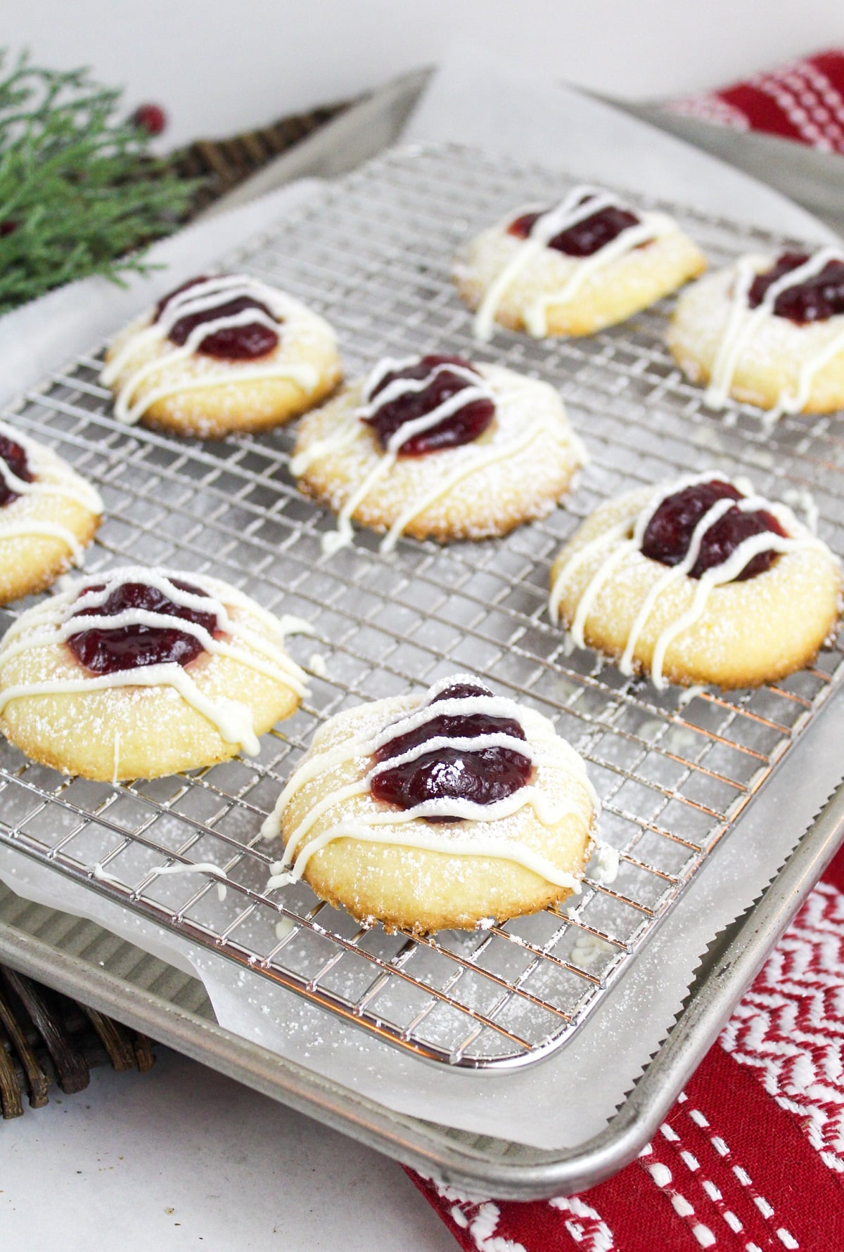 cranberry thumbprint cookies on a baking sheet