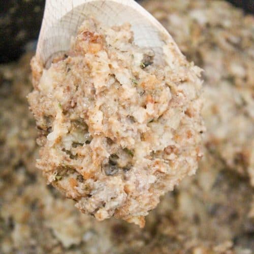 slow cooker sausage stuffing on a spoon