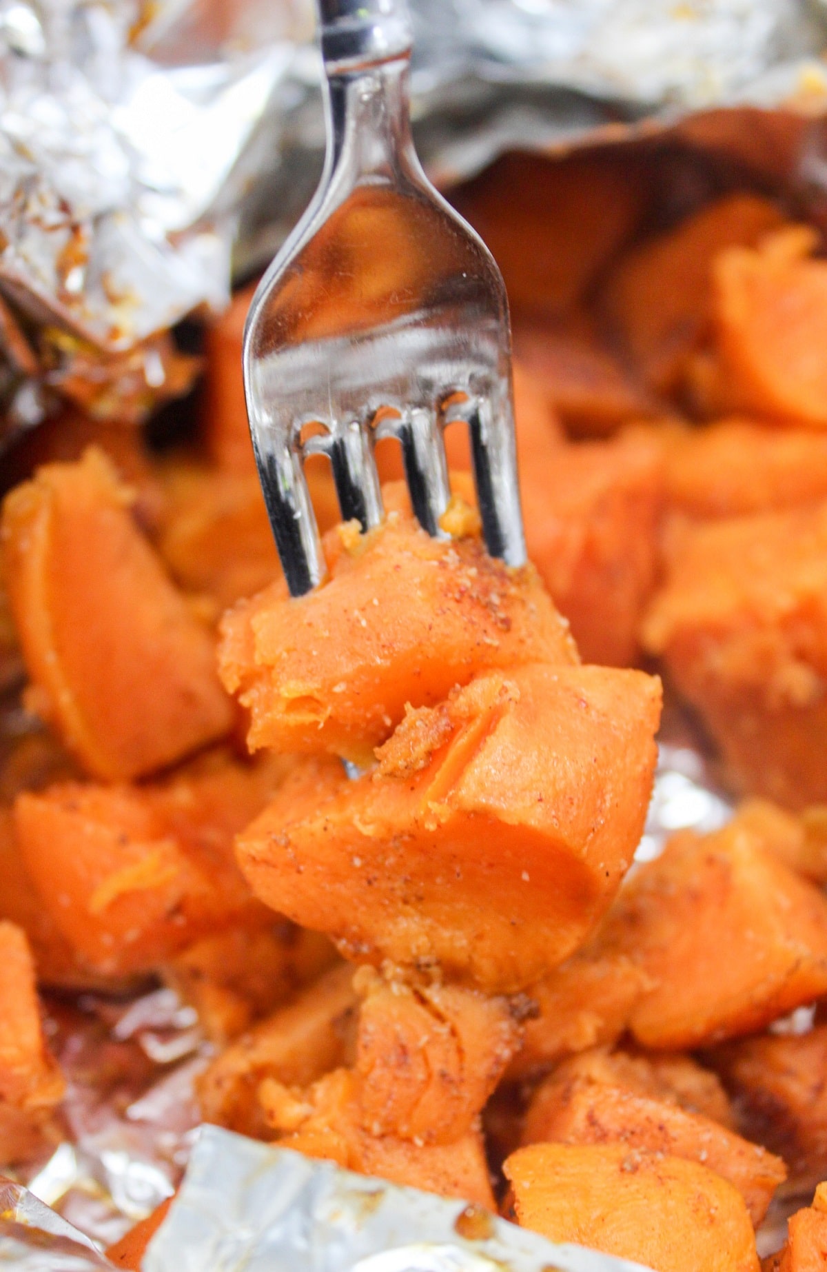 grilled sweet potatoes on a fork.