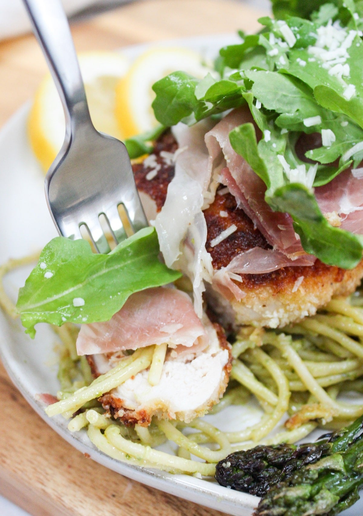 chicken bellagio cut and shown on a fork.