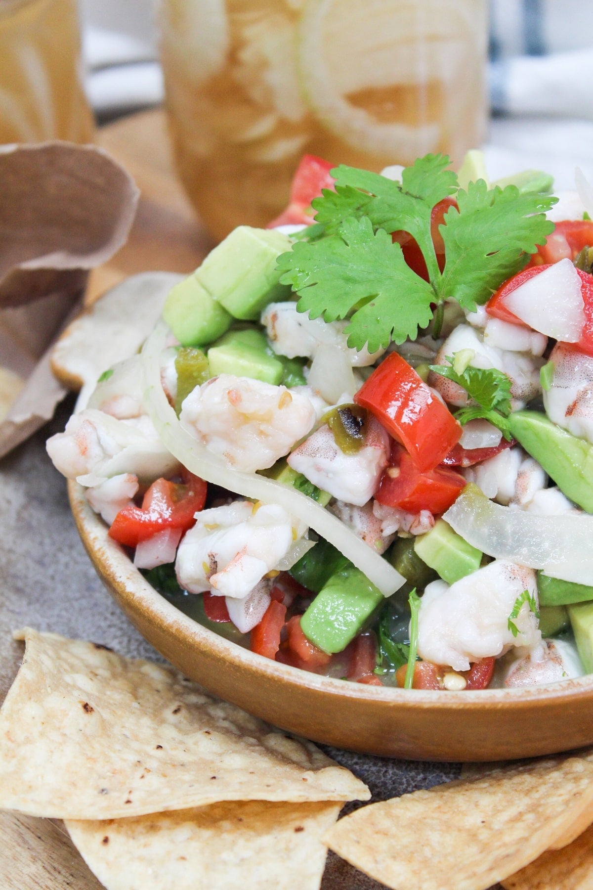 shrimp cheviche in a bowl with tortilla chips on the side