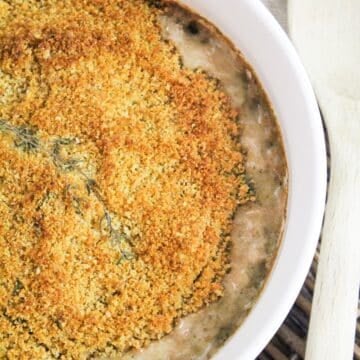 creamy mushrooms baked with a breadcrumb topping topped with fresh thyme.