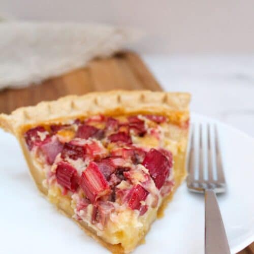 Rhubarb Custard Pie on a plate with a fork.